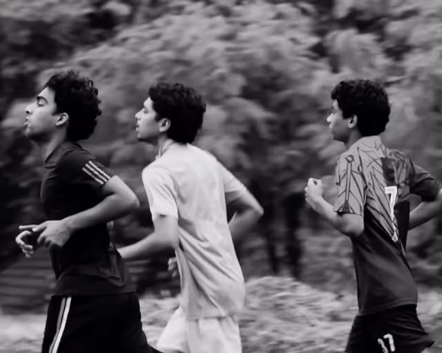 Runners in a black and white action frame